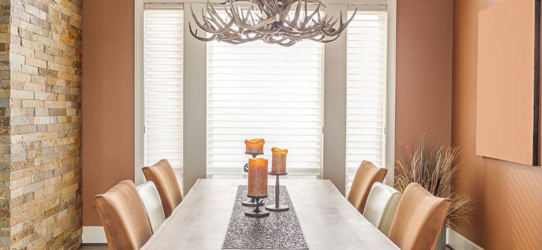 Faux wood blinds adding sophistication to the dining area in West Hollywood residence