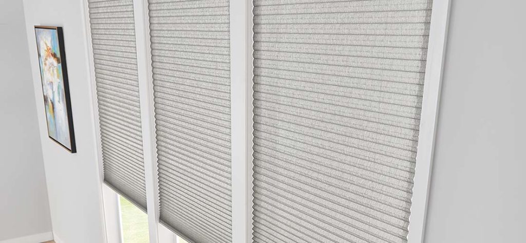 Calabasas living: Modern bedroom featuring cellular window shades.