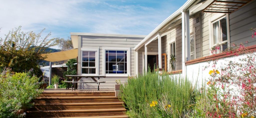 Exterior window coverings protecting furniture from sun damage.