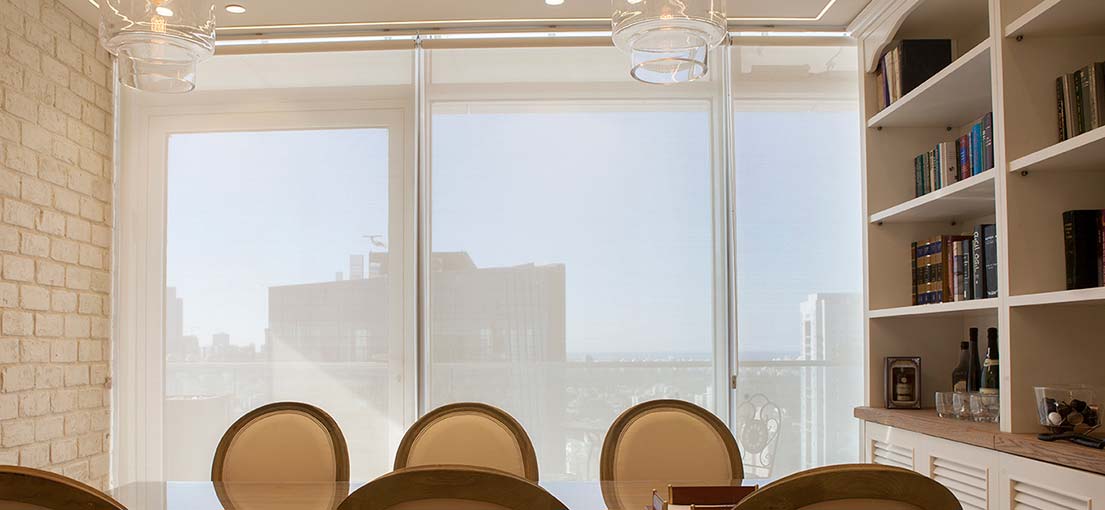 Control light and privacy with electric roller shades in Artesia.