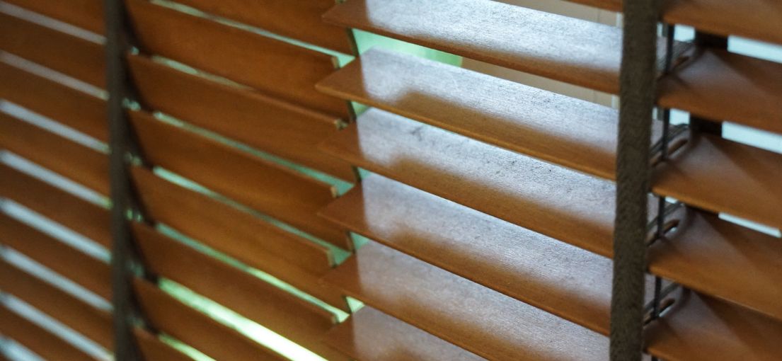 Close-up of wooden blinds in Huntington Park, displaying the intricate wood grain and high-quality finish.