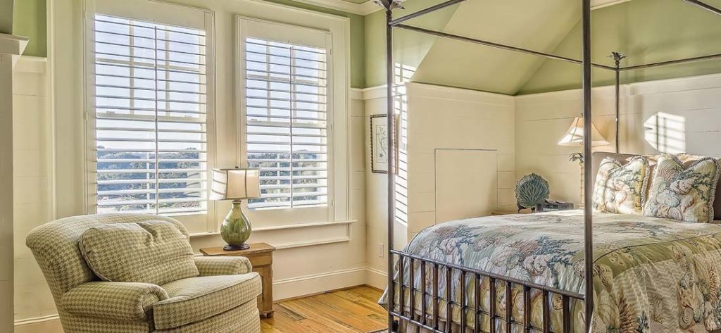 Custom blackout blinds create a dark and restful atmosphere in Vincent's bedroom.