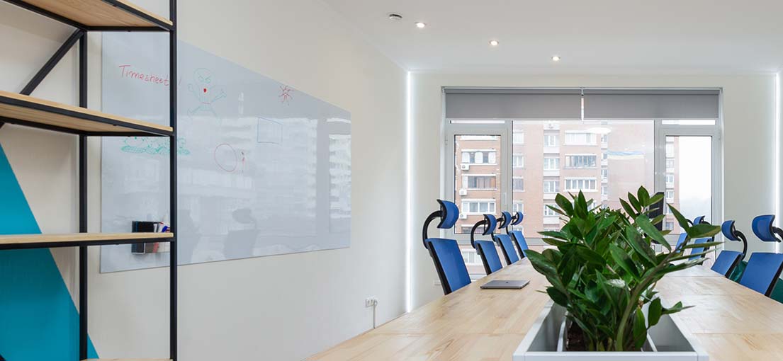Modern office in Citrus features sleek motorized roller shades for light control.