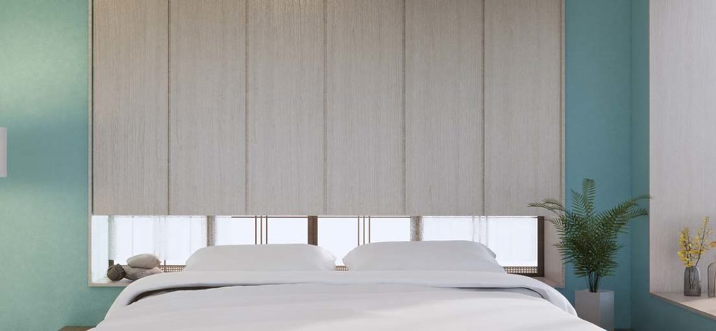 White roller shades complement the calming atmosphere of a San Marino bedroom.