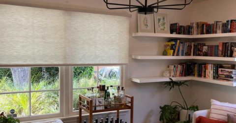 A view on a elegant living room with roller shades