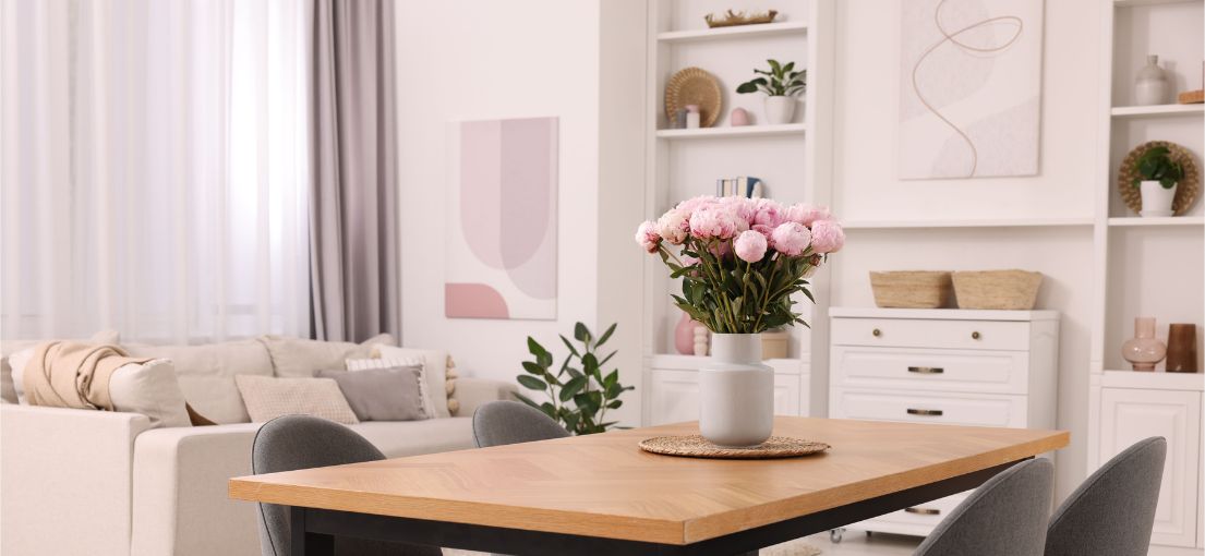 Elegant living and dining area with aluminum blinds and silky drapery