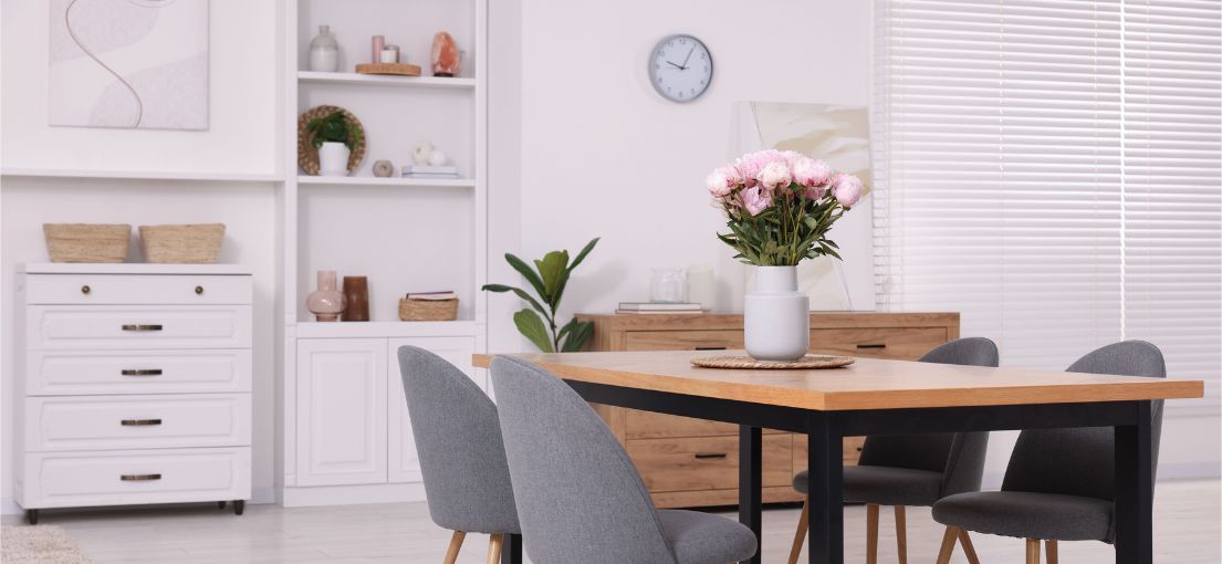 Elegant living and dining area with aluminum blinds and silky drapery