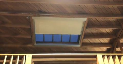 Close-up of Somfy motorized roller shade installed in skylight of Venice guest house