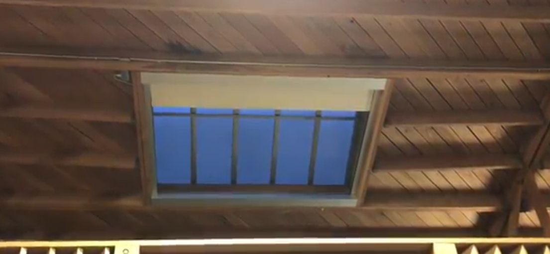 Wide view of automated skylight shades blending seamlessly with modern ceiling design