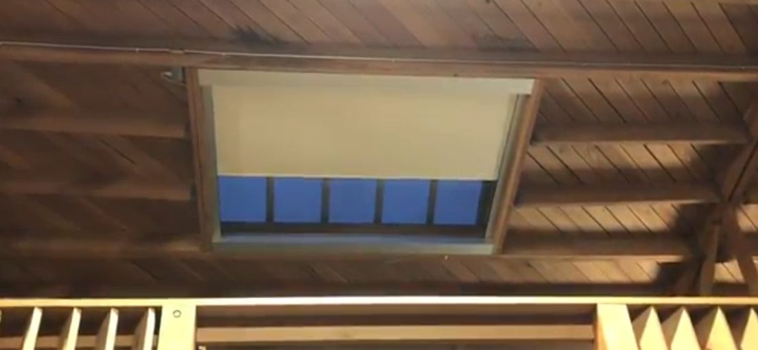 Custom motorized roller shades installed by Master Blinds in guest house skylight