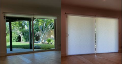 Elegant Somfy electric roller shades in a Malibu living room