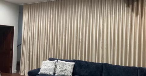 Master Blinds installed custom motorized curtains in Brynn Barge’s West Hollywood media room for ultimate blackout control and modern design.