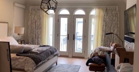 Motorized floral drapes with sheer white curtains in Culver City bedroom.