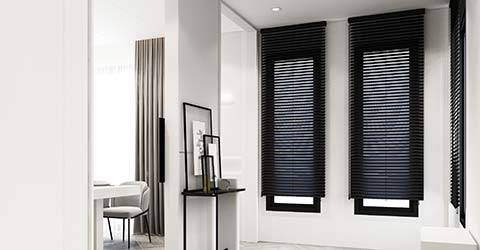 Bright minimalist reception hall with a black blinds on a windows