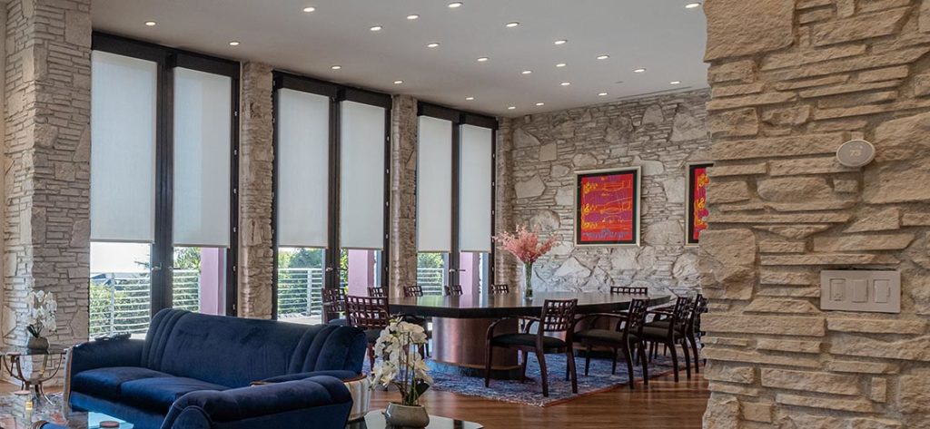 A view on the motorized roller shades for tall dinning room windows