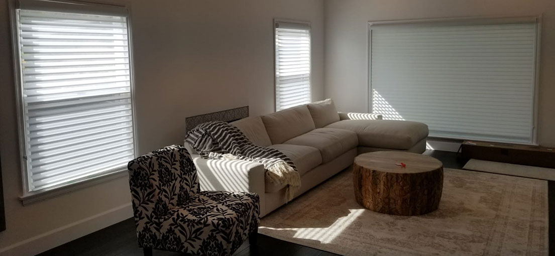 A view to motorized cellular shades in a living room