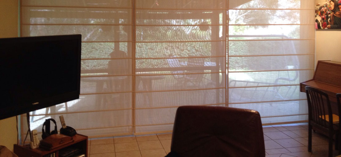 A view at living room with motorized Roman shades