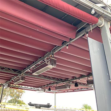 A view at a motorized patio restaurant shading