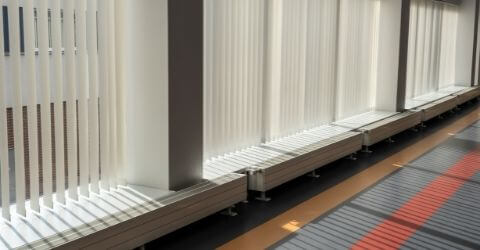 An office with a motorized vertical blinds