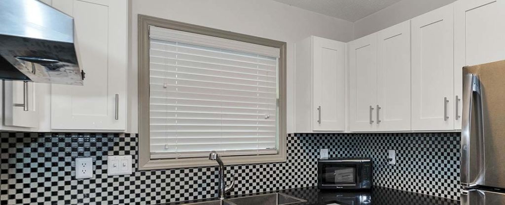 Kitchen window with Venetian blinds