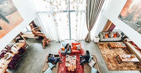 Open living room with sliding blinds providing privacy when needed.