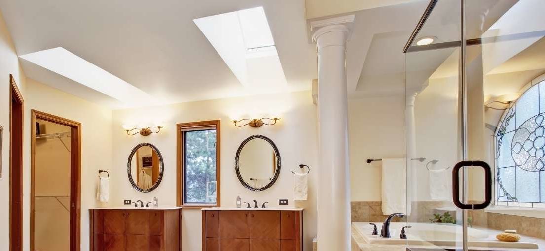 A luxury bathroom with motorized skylight shading system