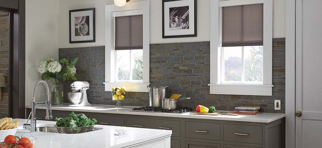 A view at Lutron motorized shades in kitchen