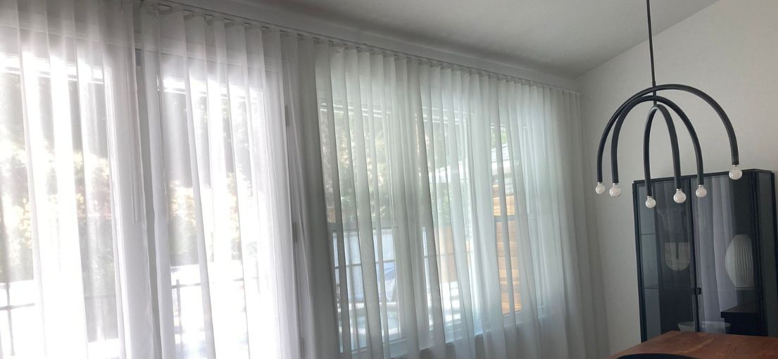 A view at curtains and drapes in dining room
