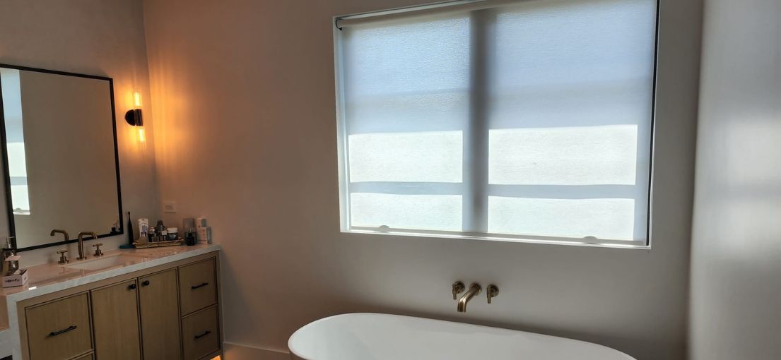A view at roller window shades in bathroom 1