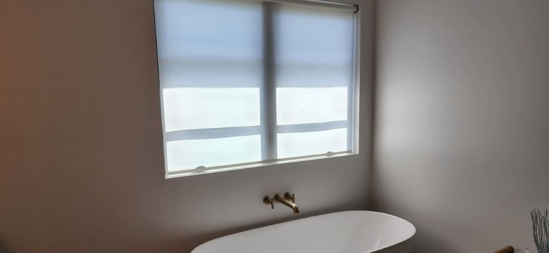 A view at roller window shades in bathroom 2