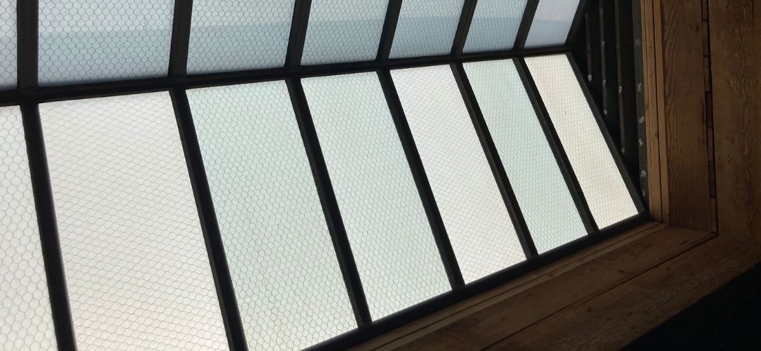 A view on a barn roof with skylight window