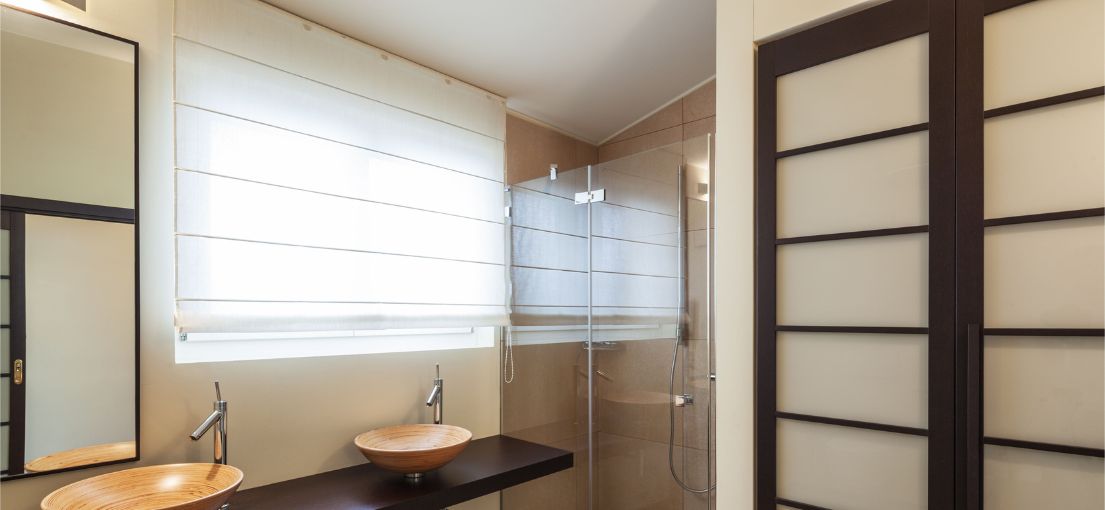 View to a Roman window shades in a modern bathroom