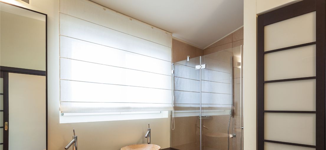 View to a Roman window shades in a modern bathroom
