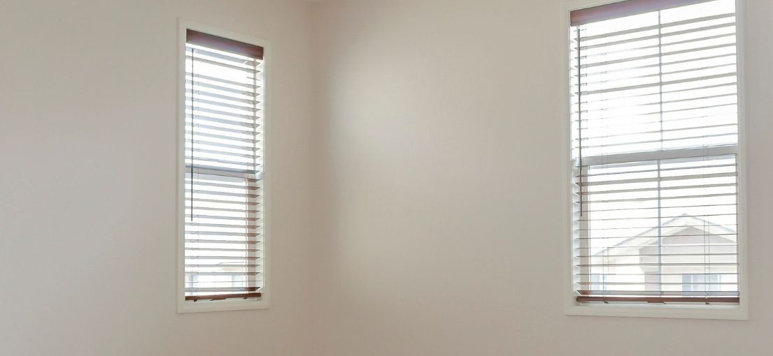 Empty Master bedroom with horizontal window blinds