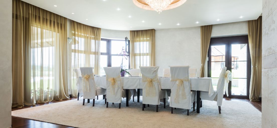 Luxury dining area with motorized custom curtains