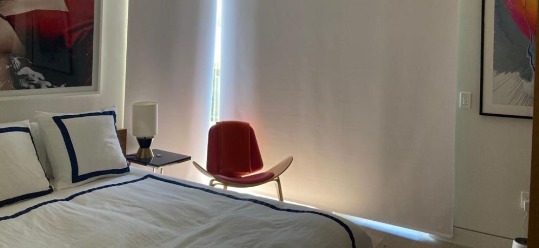 Luxury bedroom with motorized shading system