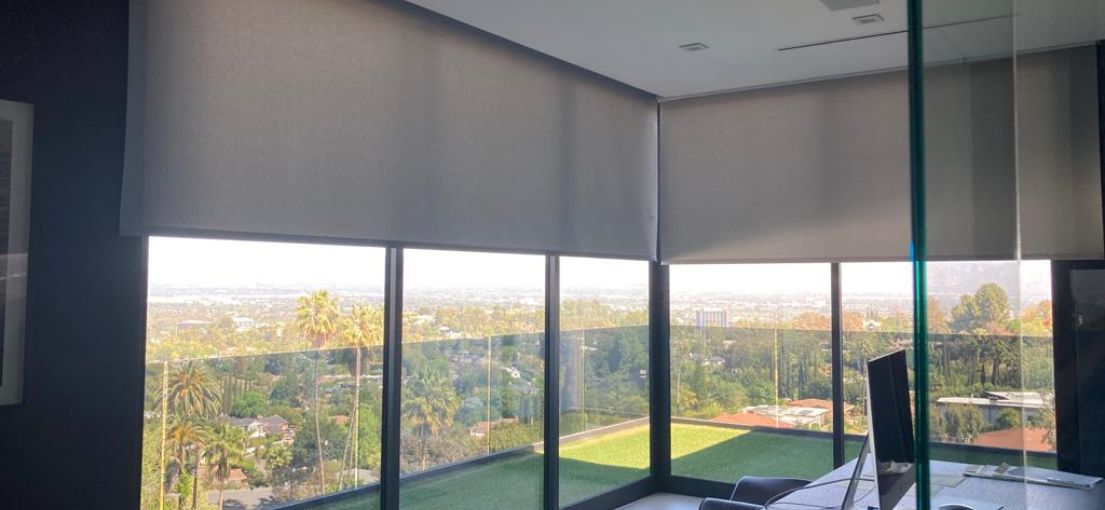 Luxury home office with motorized window shading system