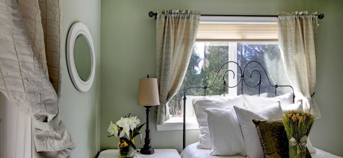 Master Blinds' Bedroom Makeover with Custom Drapes and Honeycomb Shades