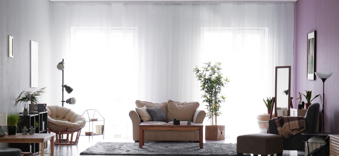 Light-filtering custom draperies complement the contemporary ambiance of a Chatsworth living space.