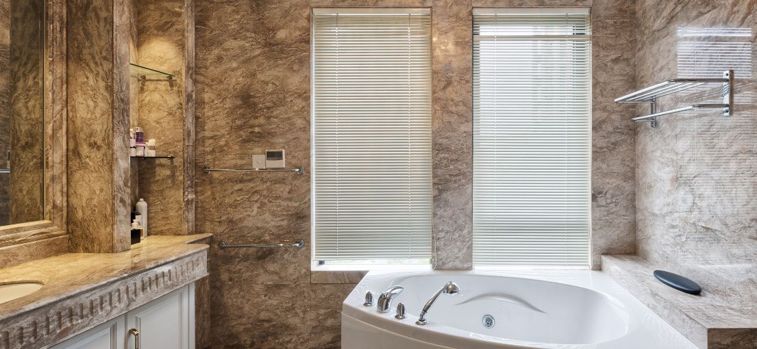 Chic window treatment with mini blinds in a lavish bathroom