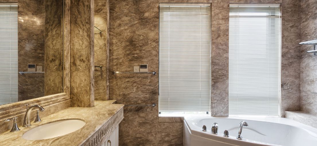 Chic window treatment with mini blinds in a lavish bathroom